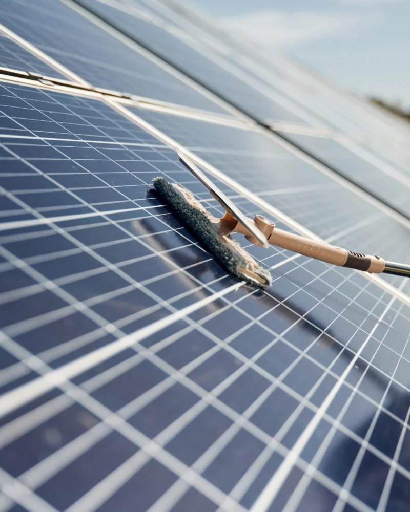 A soft cleaning brush on solar panels