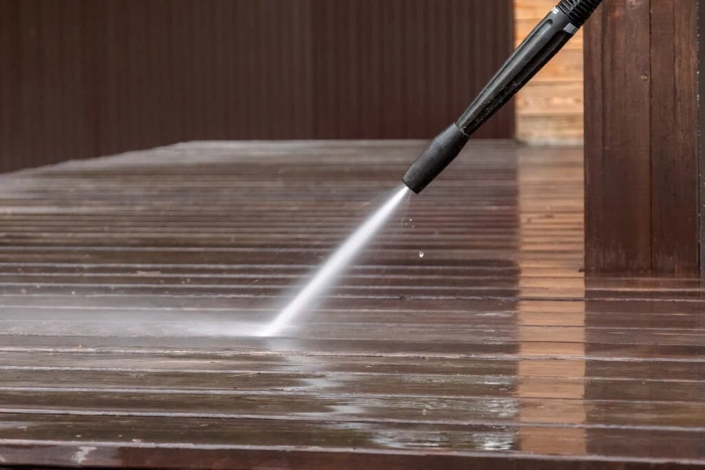 Water being directed across an exterior deck surface