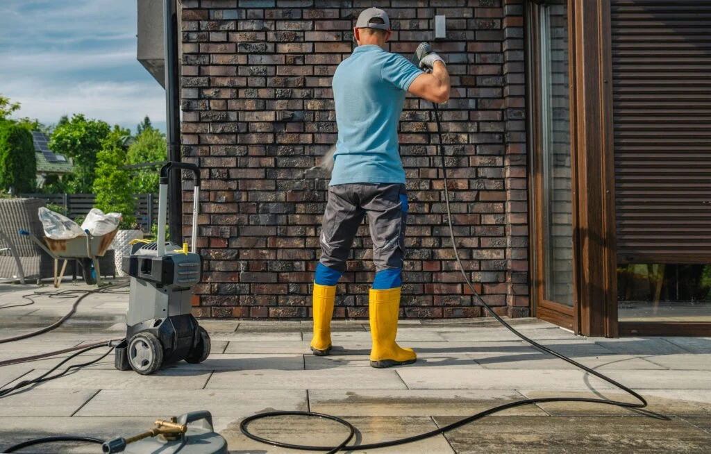 Exterior wall washing with a pressure washer