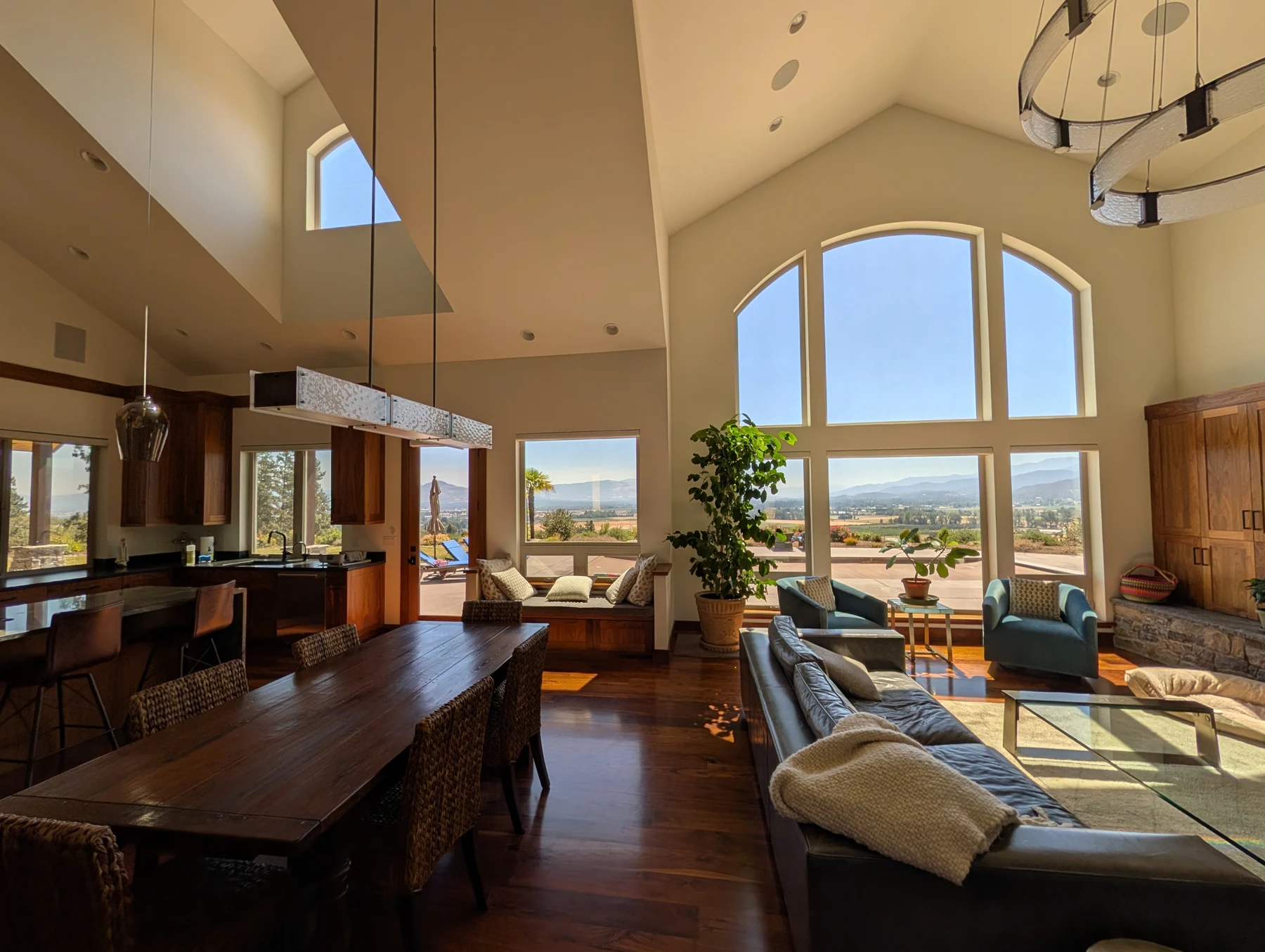 Tall arched windows overlooking a valley